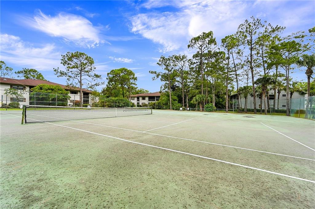 1933 Courtyard Way, Unit D103 Naples, FL 34112 - Photo 22 of 24 a view of a basketball court