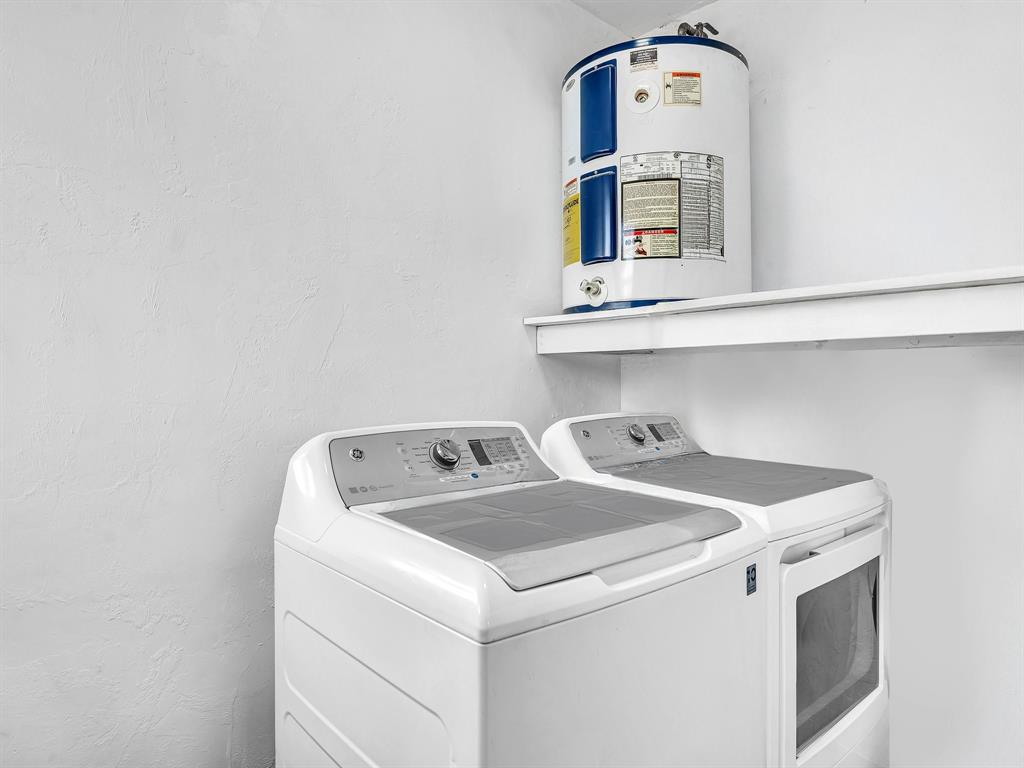 1052 Northwest 103rd Street Miami, FL 33150 - Photo 12 of 40 a utility room with dryer and washer