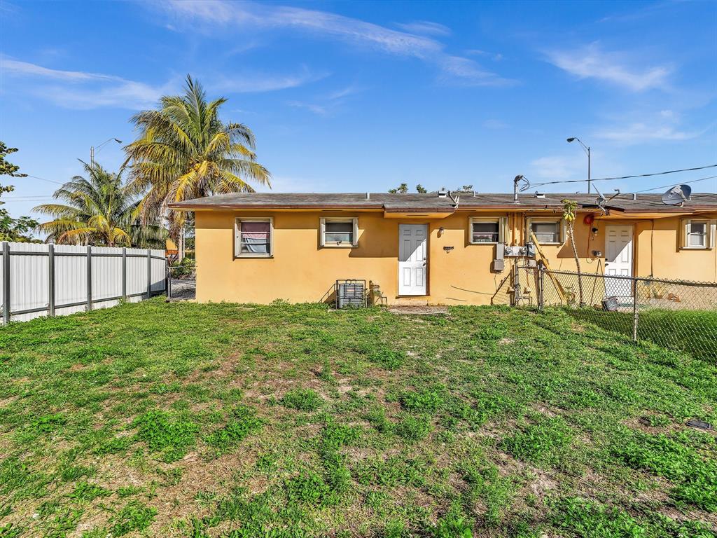 1052 Northwest 103rd Street Miami, FL 33150 - Photo 36 of 40 a view of a house with a backyard