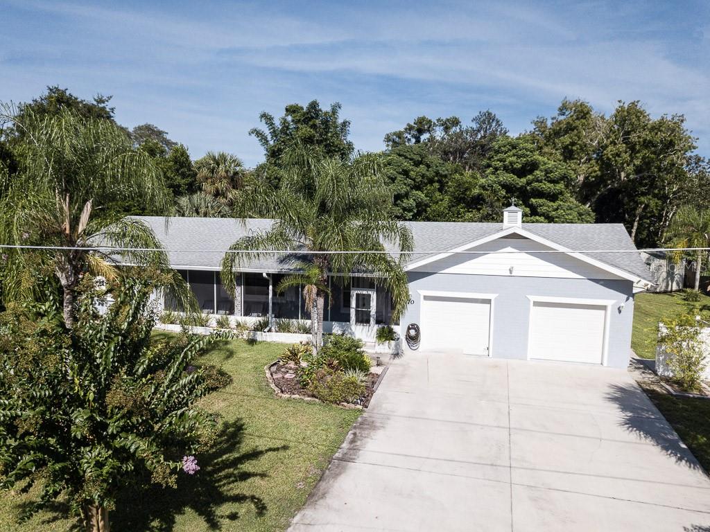 70 Alano Road DeBary, FL 32713 - Photo 1 of 1 a front view of a house with a garden
