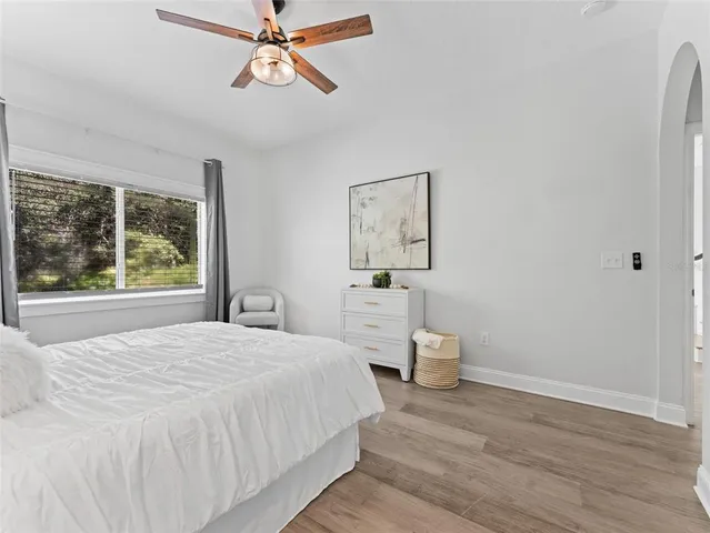 a bedroom with a bed and a dresser