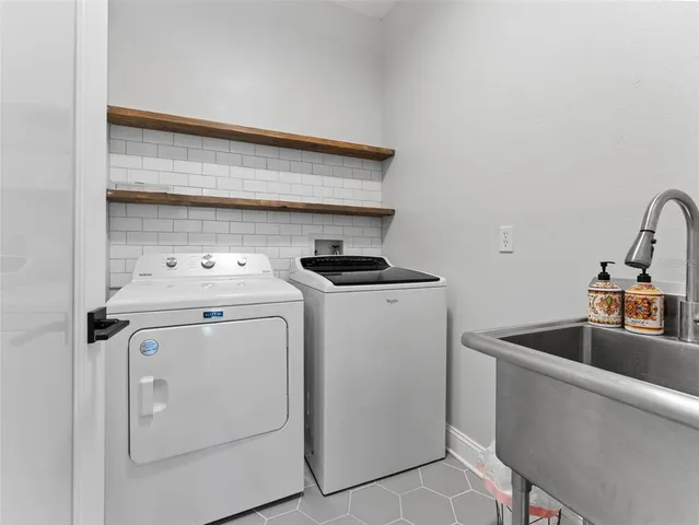 a view of a house with backyard sitting area and garden