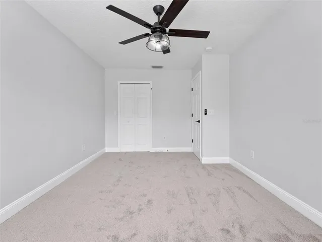 a view of a field with an trees