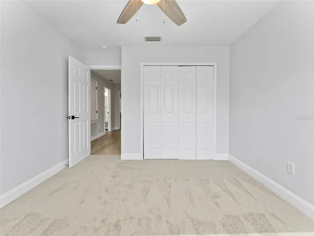 an aerial view of residential houses with outdoor space and swimming pool