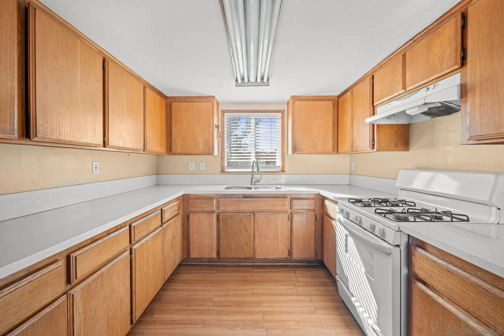 1703 Ashley Road Ramona, CA 92065 - Photo 25 of 36 a kitchen with stainless steel appliances granite countertop a stove a sink and a microwave