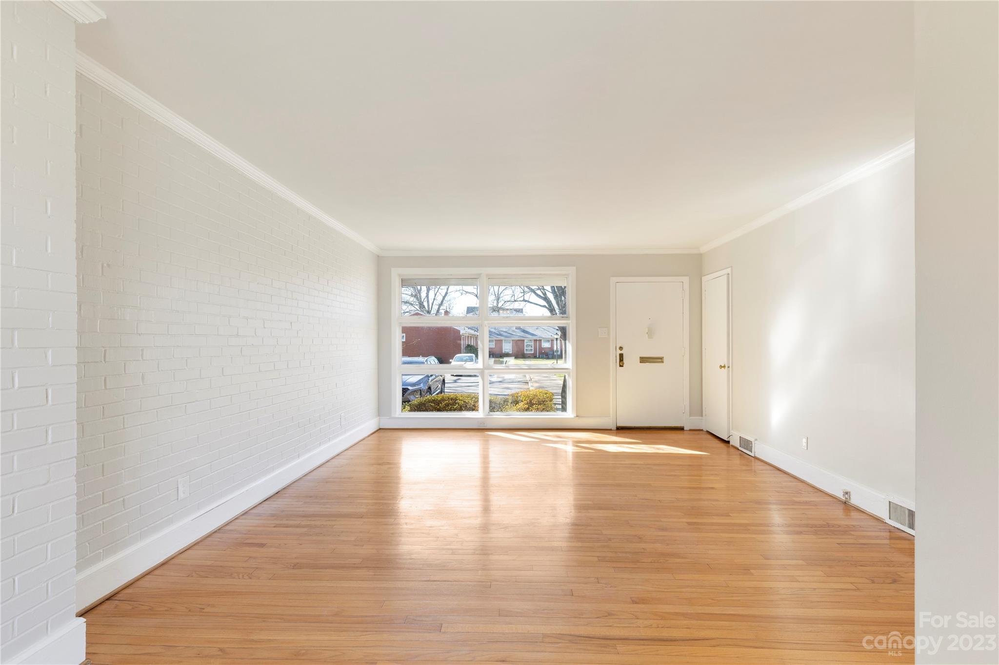 350 South Sharon Amity Road Charlotte, NC 28211 - Photo 12 of 21 a view of an empty room with a window