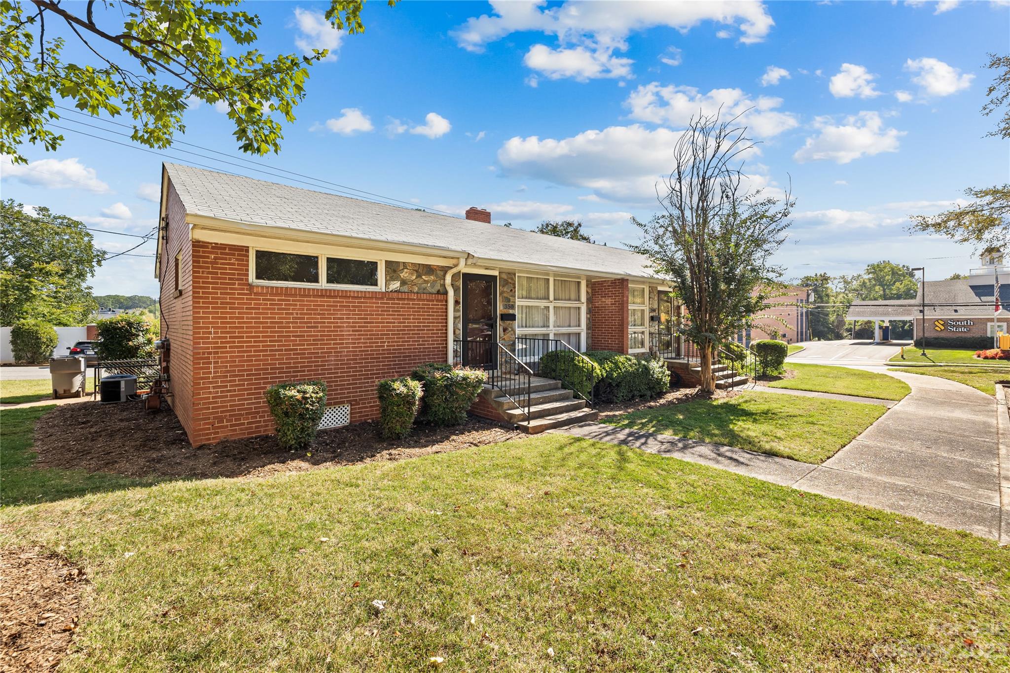 350 South Sharon Amity Road Charlotte, NC 28211 - Photo 20 of 21 a view of a house with swimming pool and sitting area