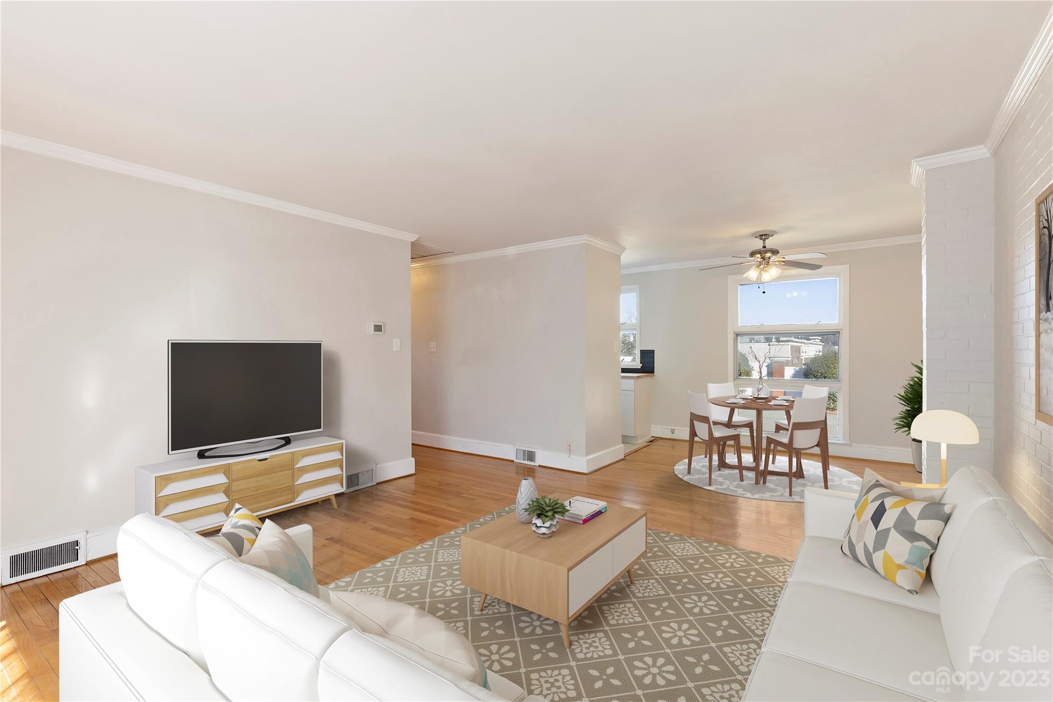 350 South Sharon Amity Road Charlotte, NC 28211 - Photo 6 of 21 a living room with furniture and a flat screen tv