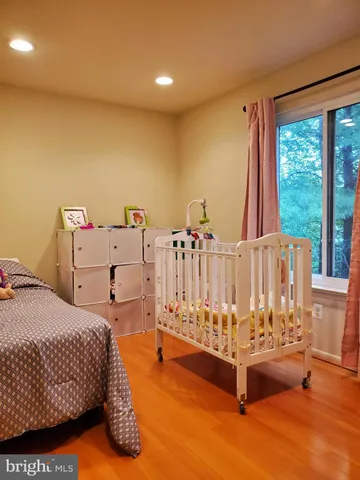 a spacious bedroom with a bed and a table