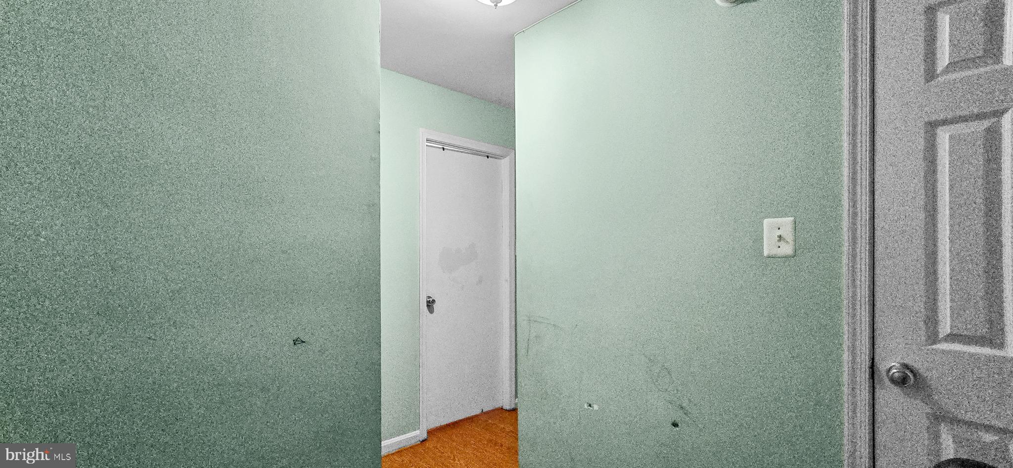 8402 Towne Crest Court Gaithersburg, MD 20877 - Photo 15 of 22 Inviting hallway with soft green hues.