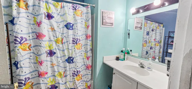 a view of a backyard with swings and slides