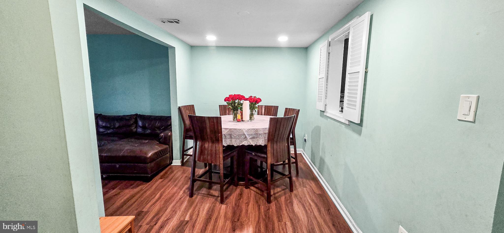 8402 Towne Crest Court Gaithersburg, MD 20877 - Photo 9 of 22 Inviting dining space with fresh blooms.