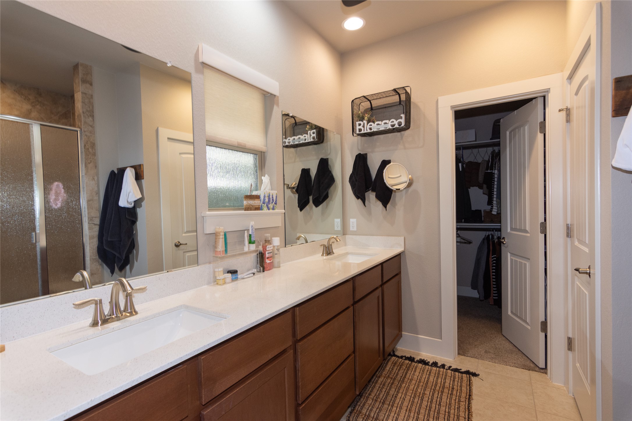 2809 Hopi Path, Unit 12 Leander, TX 78641 - Photo 22 of 34 Large master bath and walk-in closet, double vanities, huge mirror