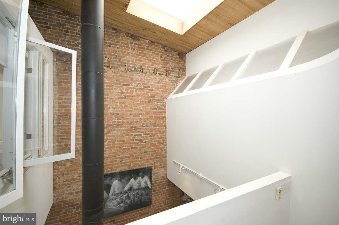 2512 Ontario Road Northwest, Unit 2 Washington, DC 20009 - Photo 17 of 23 Skylight, vaulted ceilings, exposed brick