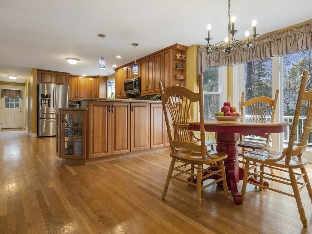 2 Deer Run Road Easton, MA 02356 - Photo 15 of 42 a view of a dining room with furniture and wooden floor