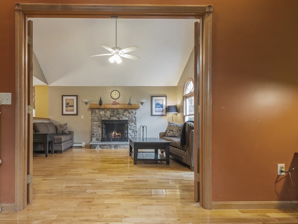 2 Deer Run Road Easton, MA 02356 - Photo 21 of 42 a living room with furniture and a fireplace
