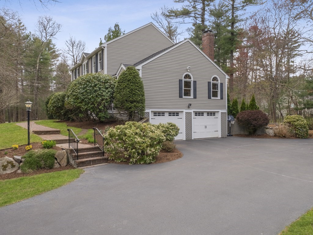 2 Deer Run Road Easton, MA 02356 - Photo 3 of 42 a view of backyard with a garden and entertaining space