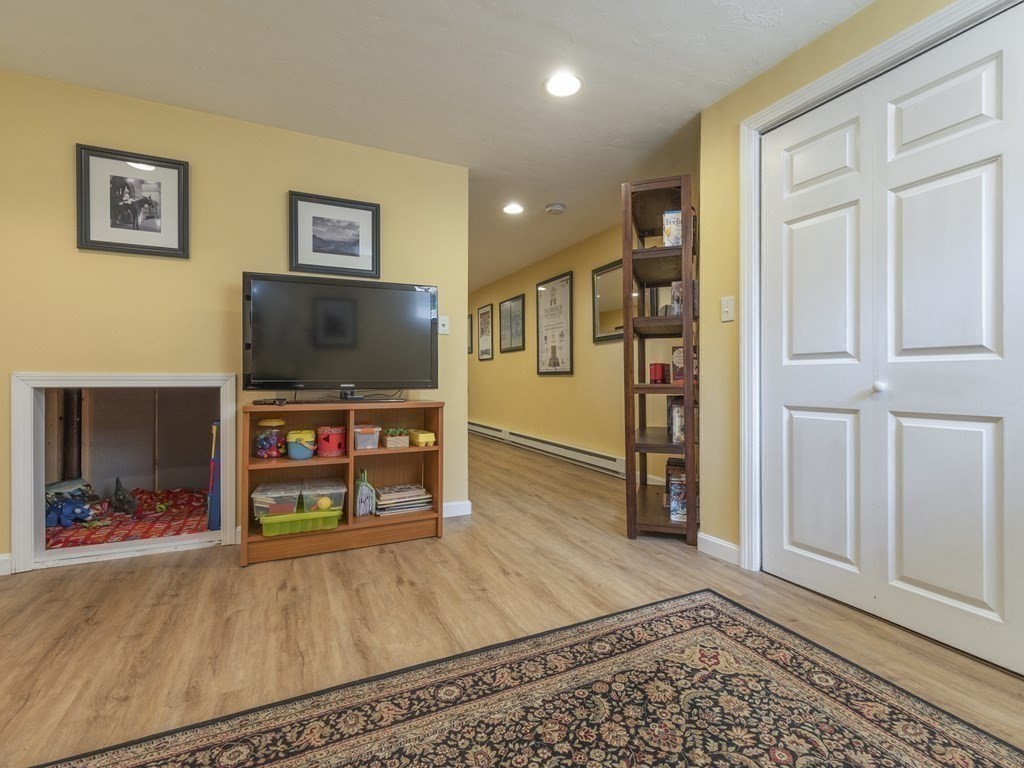 2 Deer Run Road Easton, MA 02356 - Photo 38 of 42 a living room with furniture and a flat screen tv