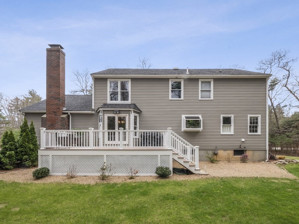 2 Deer Run Road Easton, MA 02356 - Photo 5 of 42 a front view of a house with a garden and yard
