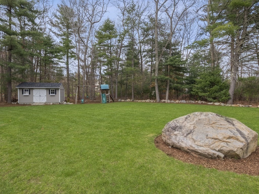 2 Deer Run Road Easton, MA 02356 - Photo 6 of 42 a view of a house with a yard and sitting area