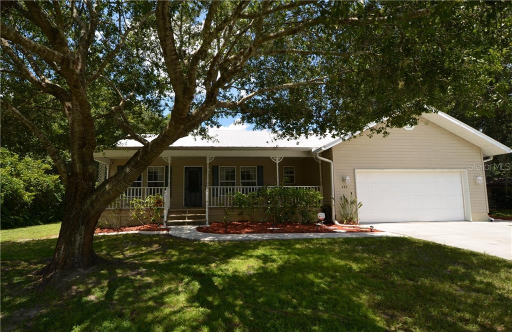 489 Encarnacion Street Punta Gorda, FL 33983 - Photo 1 of 1 a front view of house with yard and green space