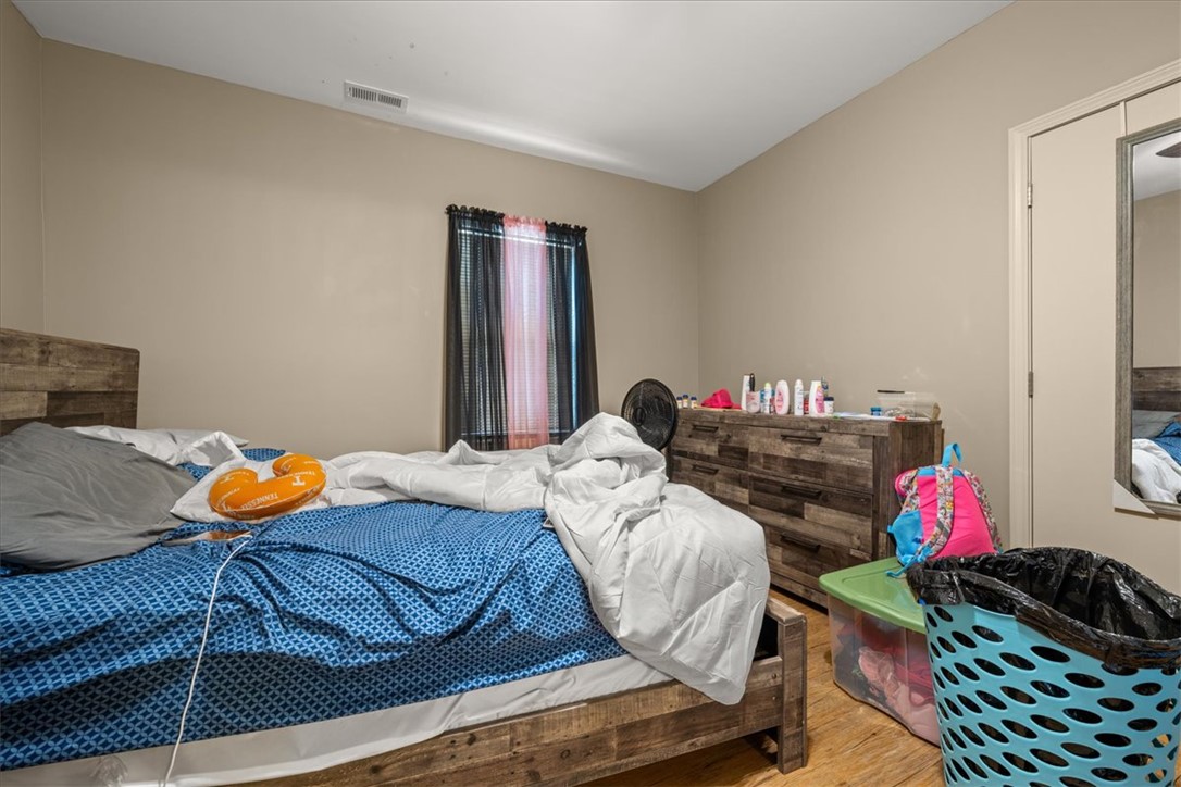 1102 West End Avenue Anderson, SC 29625 - Photo 16 of 28 Natural wood tones grace this cozy room, providing warmth and comfort for repose.