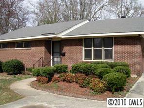 3915 Farmview Road Charlotte, NC 28205 - Photo 1 of 5 a front view of a house with garden