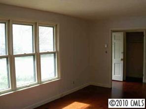 3915 Farmview Road Charlotte, NC 28205 - Photo 4 of 5 an empty room with a window
