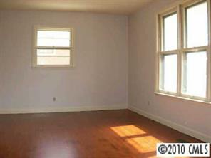 3915 Farmview Road Charlotte, NC 28205 - Photo 5 of 5 an empty room with a window