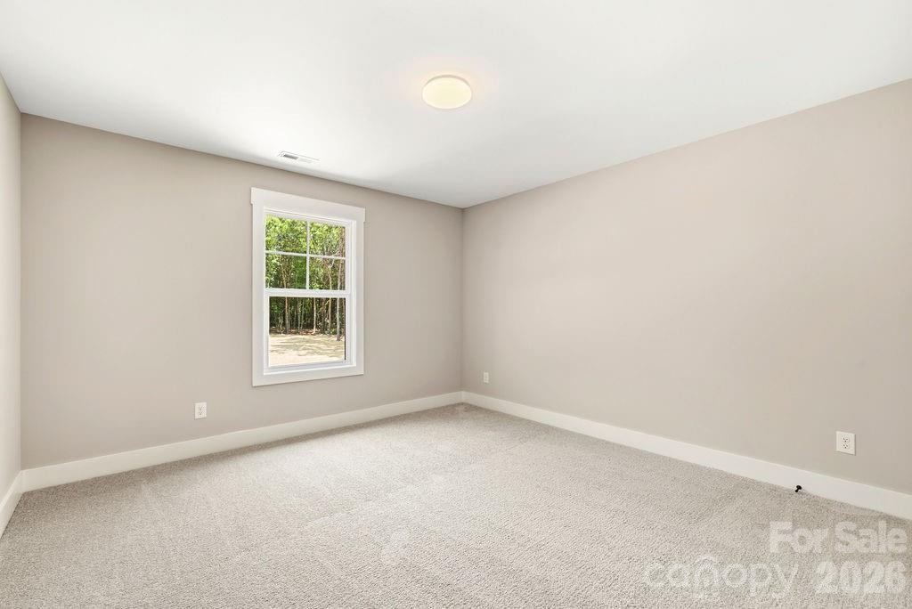 1020 Baylor Grove Road, Unit 20 Monroe, NC 28112 - Photo 33 of 45 an empty room with a window
