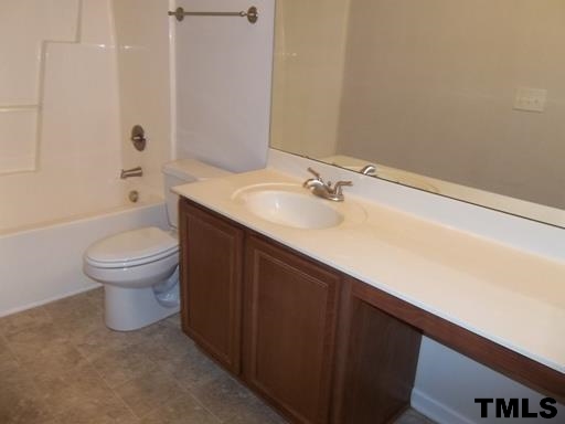 3231 Sunbright Lane Raleigh, NC 27610 - Photo 12 of 15 a bathroom with a sink and a toilet