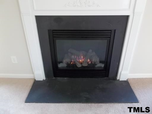 3231 Sunbright Lane Raleigh, NC 27610 - Photo 14 of 15 a living room with a fireplace
