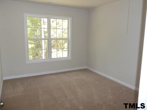 3231 Sunbright Lane Raleigh, NC 27610 - Photo 10 of 15 an empty room with a window