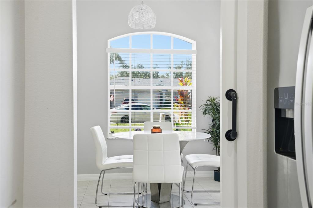 12505 Cavalier Court Hudson, FL 34669 - Photo 18 of 36 a view of a dining room with furniture window and outside view