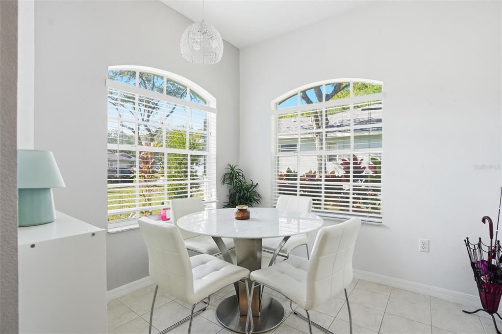12505 Cavalier Court Hudson, FL 34669 - Photo 19 of 36 a dining room with furniture and window