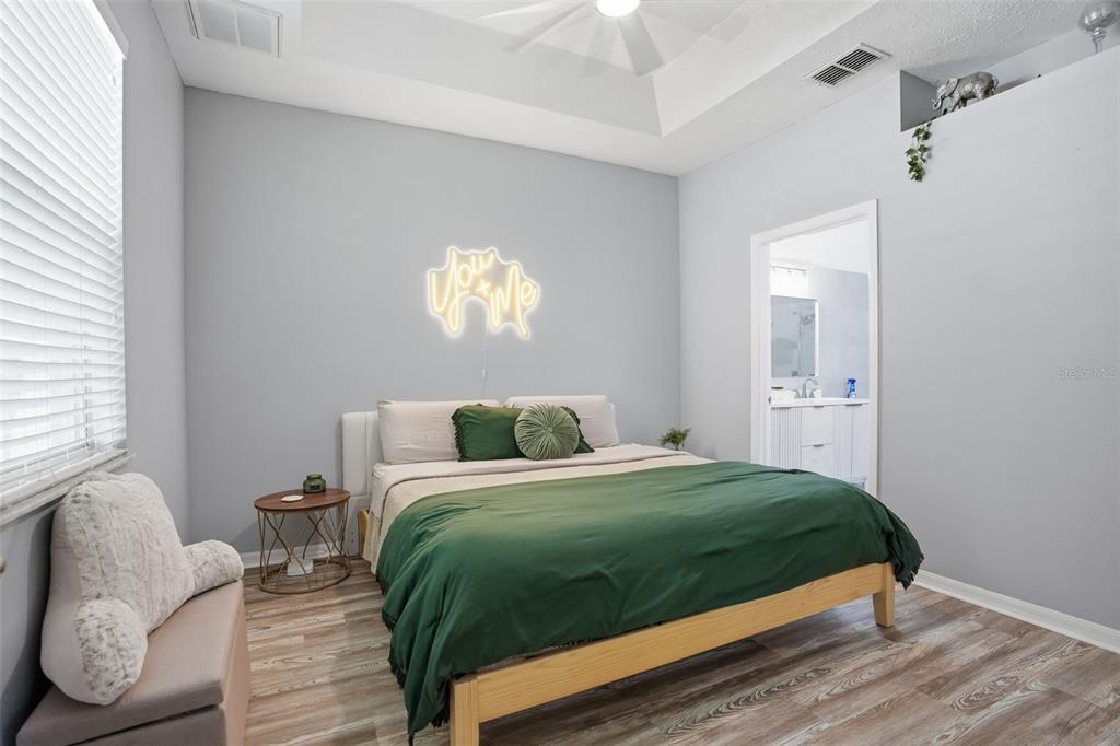 12505 Cavalier Court Hudson, FL 34669 - Photo 22 of 36 a bedroom with a bed and a chair