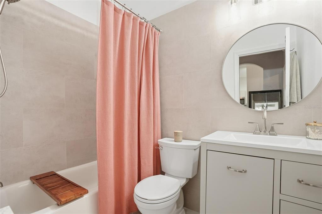 12505 Cavalier Court Hudson, FL 34669 - Photo 26 of 36 a bathroom with a toilet a sink and a mirror