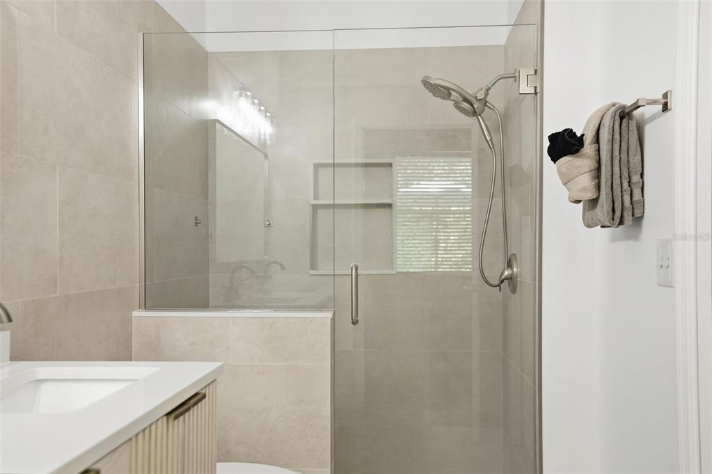 12505 Cavalier Court Hudson, FL 34669 - Photo 29 of 36 a bathroom with a shower and a sink