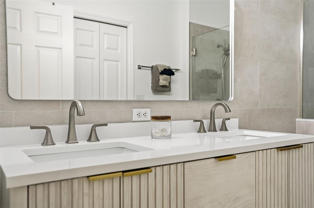 12505 Cavalier Court Hudson, FL 34669 - Photo 30 of 36 a bathroom with a sink and a mirror