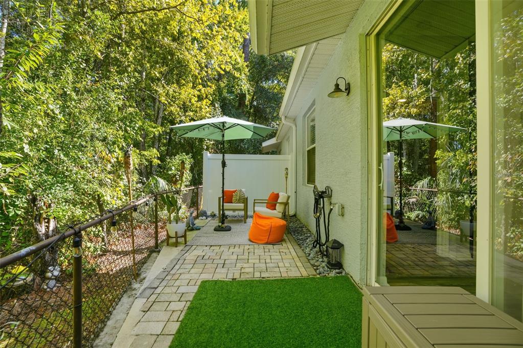 12505 Cavalier Court Hudson, FL 34669 - Photo 33 of 36 a view of a porch with furniture and garden