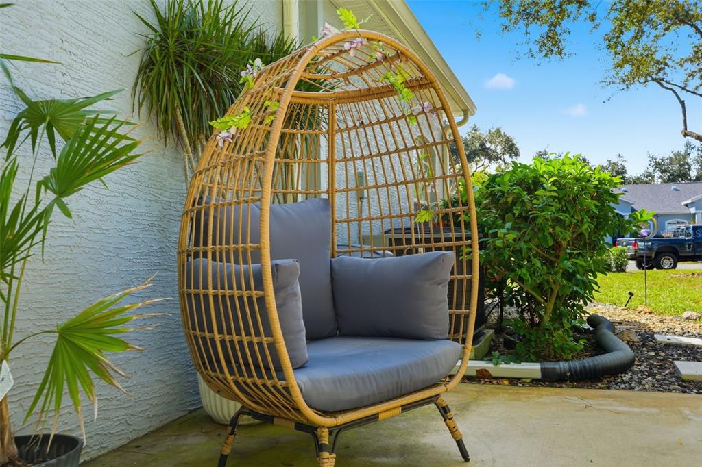 12505 Cavalier Court Hudson, FL 34669 - Photo 35 of 36 a view of balcony with two chairs and a potted plant