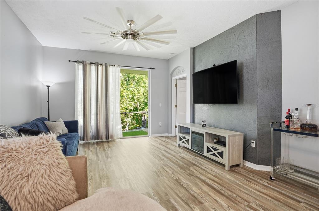 12505 Cavalier Court Hudson, FL 34669 - Photo 6 of 36 a living room with furniture and a flat screen tv