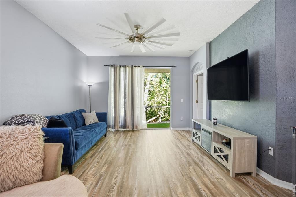 12505 Cavalier Court Hudson, FL 34669 - Photo 8 of 36 a living room with furniture and a flat screen tv