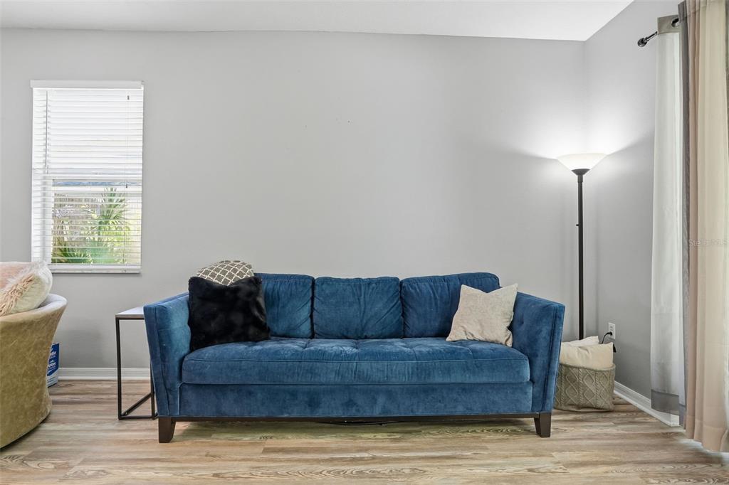 12505 Cavalier Court Hudson, FL 34669 - Photo 9 of 36 a living room with furniture and a window