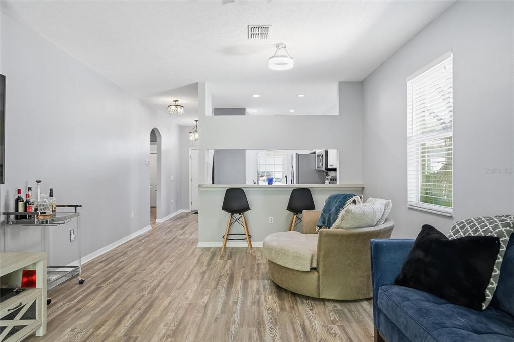 12505 Cavalier Court Hudson, FL 34669 - Photo 10 of 36 a living room with furniture and a wooden floor