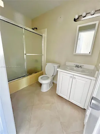 a bathroom with a toilet and a sink