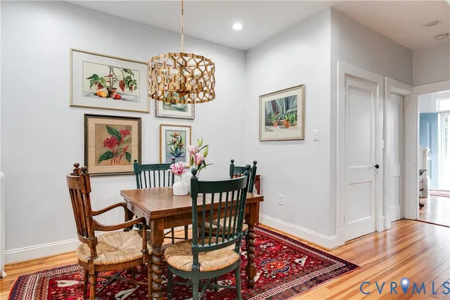 a view of a dining room with furniture wooden floor and a rug