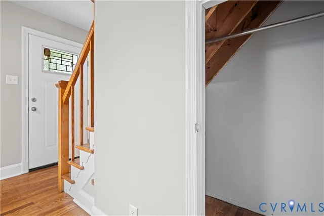 a view of front door with wooden floor