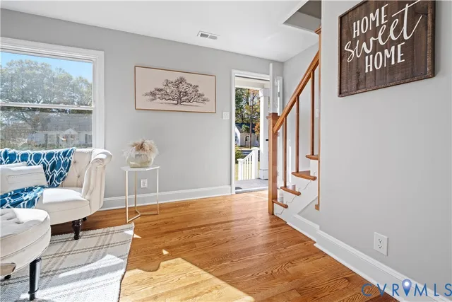 a living room with furniture and a rug