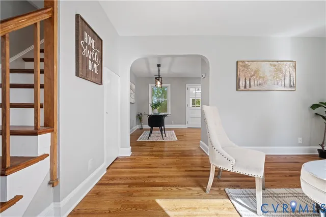 a living room with furniture and a rug